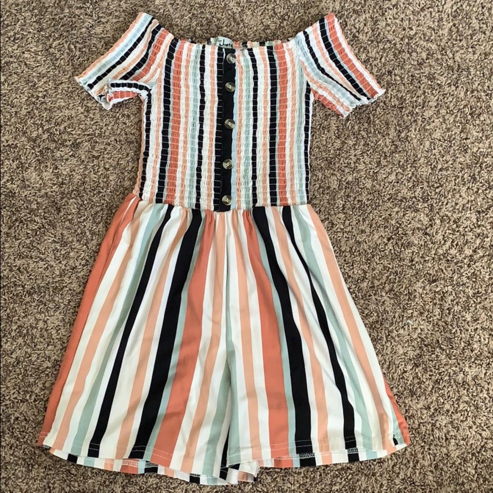 It is a romper that’s cut mid thigh.